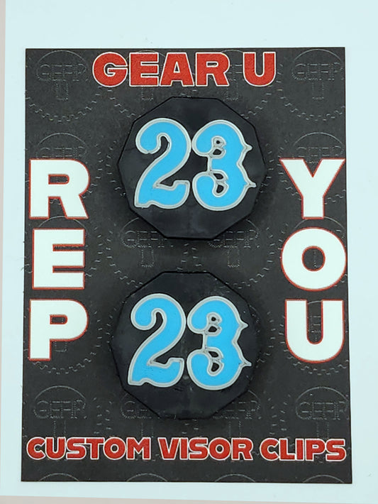 Black clips, light blue number 23, silver outline